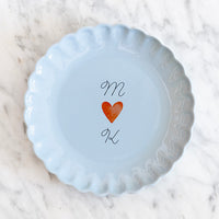 Frisblauw feestbord verticaal gepersonaliseerd met twee letters en een hartje